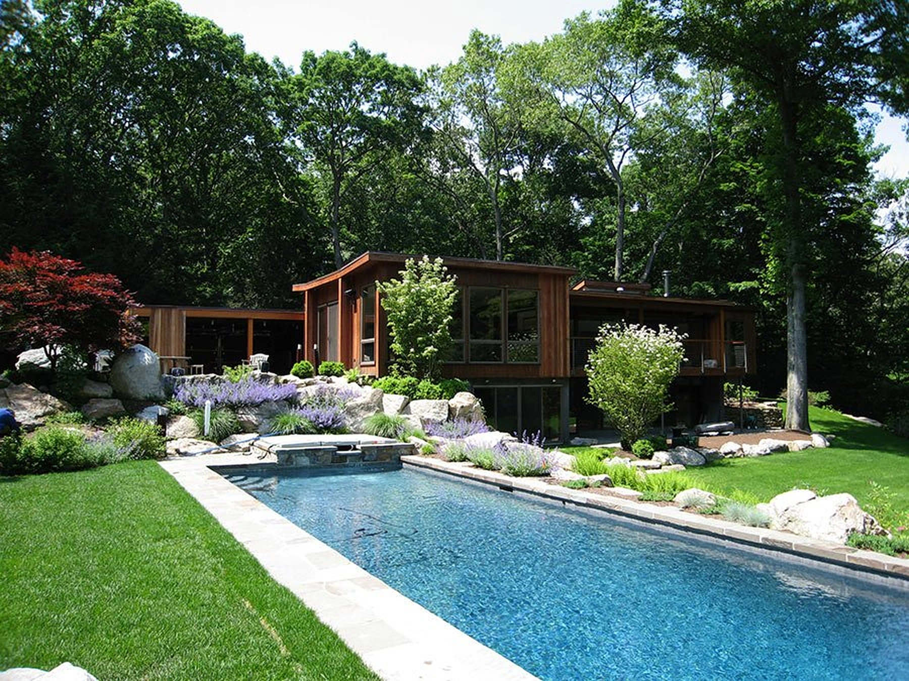 Modern Cradle Rock Road home overlooking its pool and gardens